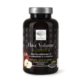 New Nordic Hair Volume™-gummibonbons med æble, urter og biotin. Biotin og zink bidrager til at opretholde normalt hår.