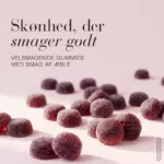 En masse dine små velsmagende gummies liggende på en lyserød baggrund med overskriften: Skønhed, der smager godt